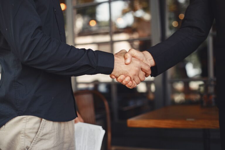 Home 10 men shake hands enclosure business agreement understanding business partners 1